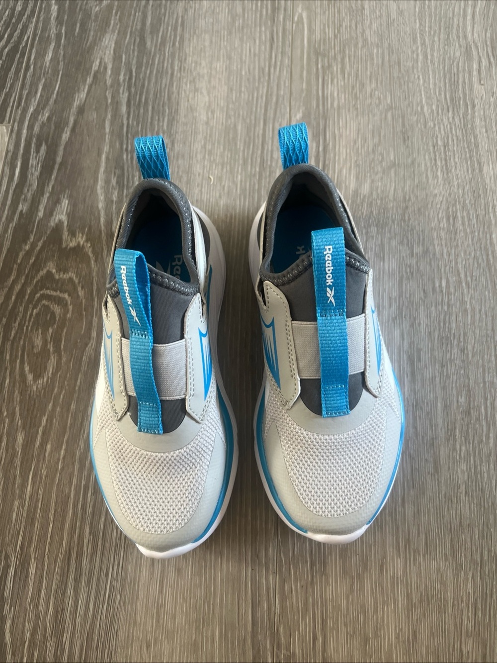 Reebok Kids Slip-On Sneakers in White & Blue
